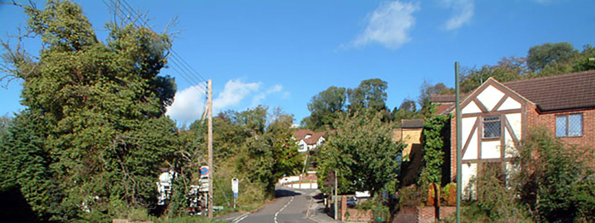 a street in Biggin Hill in the sunshine on a cloudless day