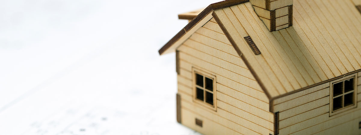 Miniature house model with a house layout plan