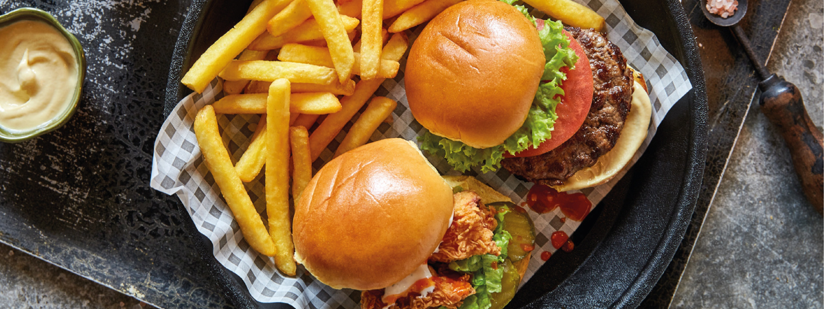 A tray of burgers and fries in a London restaurant 