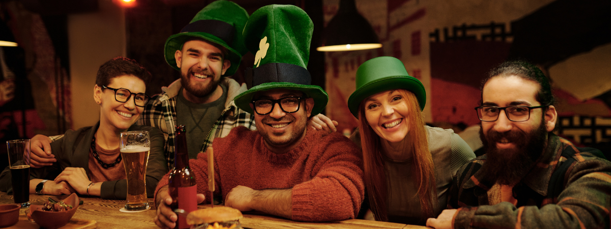 A group of friends celebrating St Patrick's Day in a bar in London