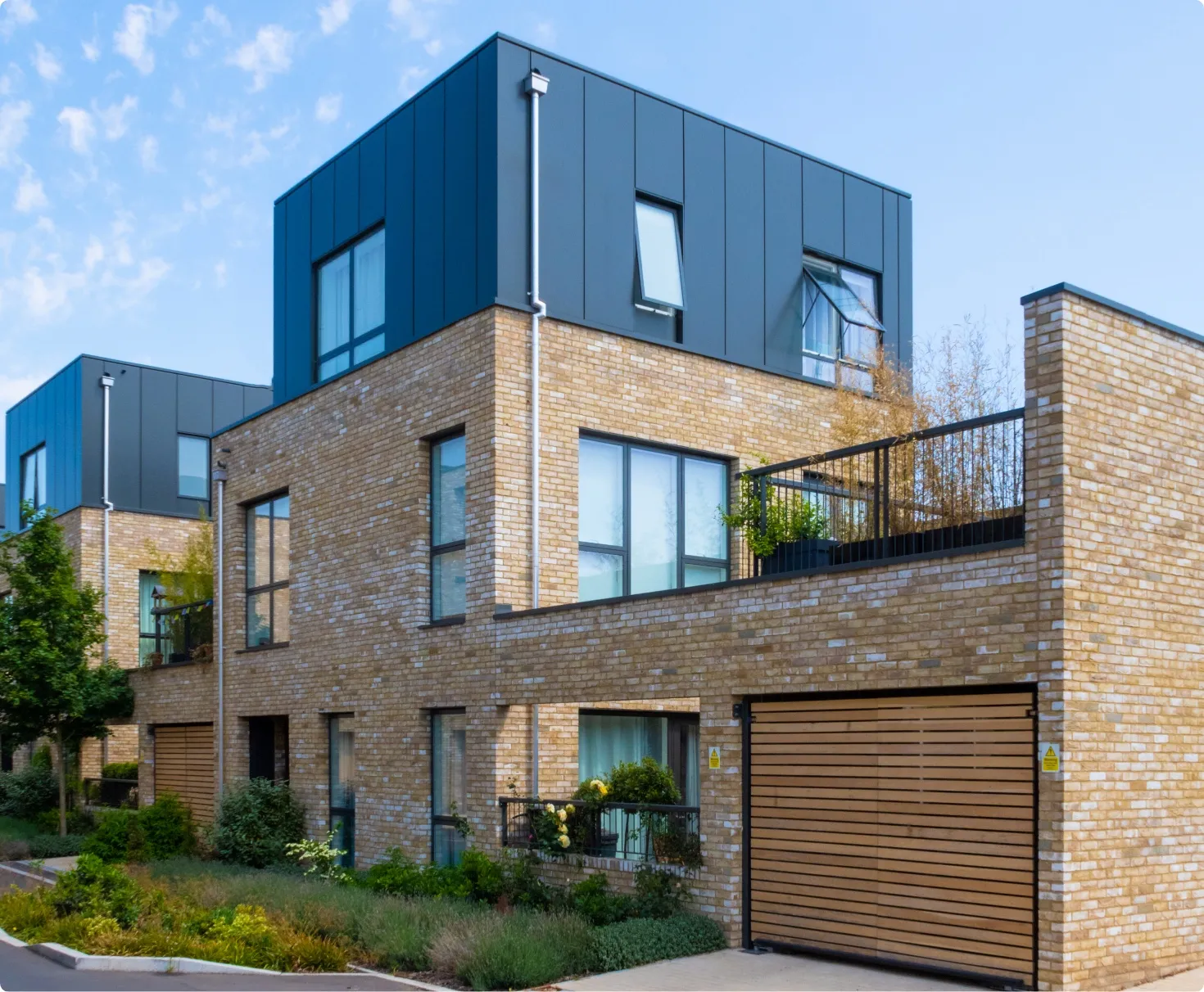 Letting agent showing tenants around a modern flat in London