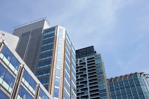 Letting agent showing tenants around a modern flat in London
