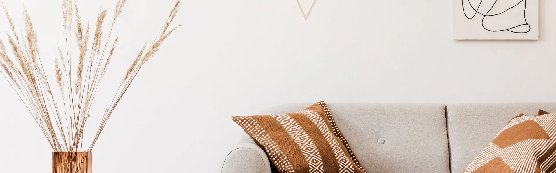 A clean and modern London apartment living room with a taupe colour scheme