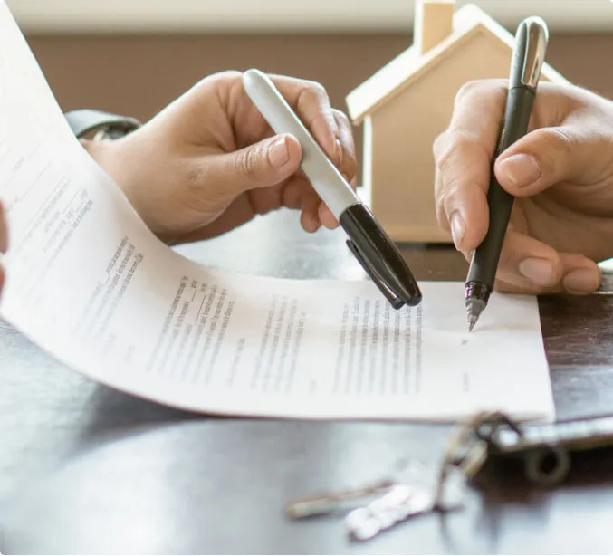 person is signing a letting agreement