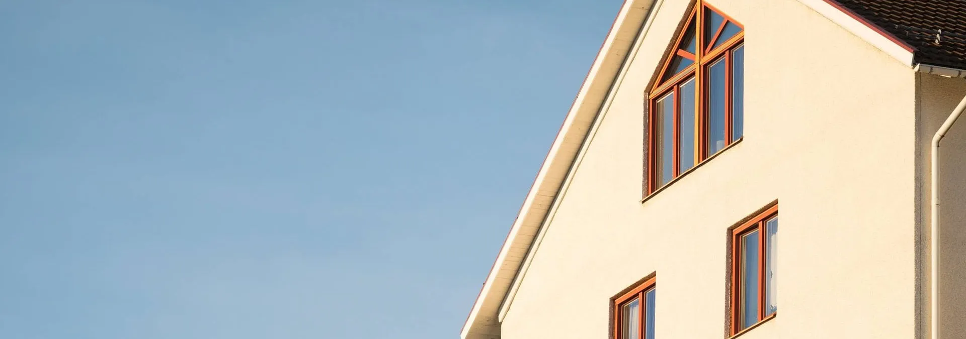 modern, new build flat against a clear blue sky