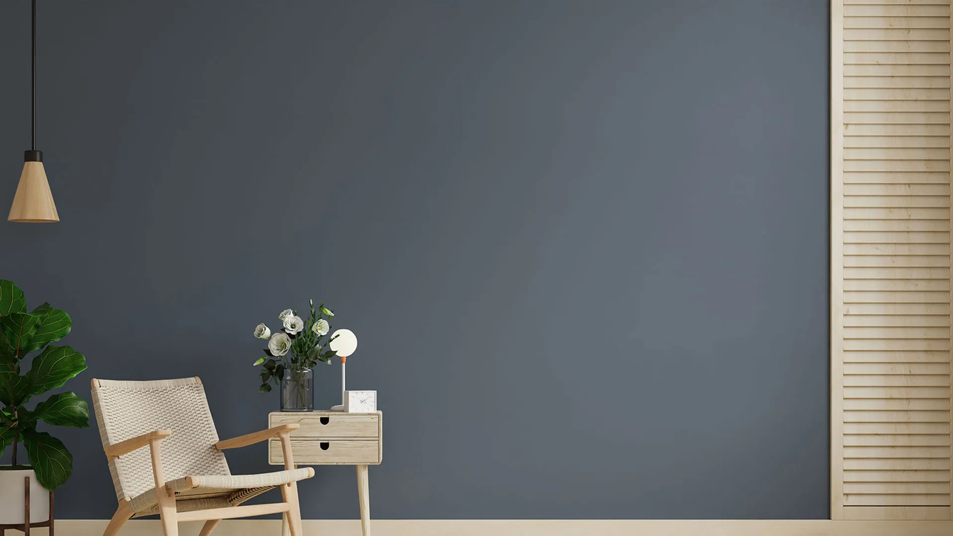 a beautiful guaranteed rent flat in London with a wicker chair and pretty flowers on a wooden floor