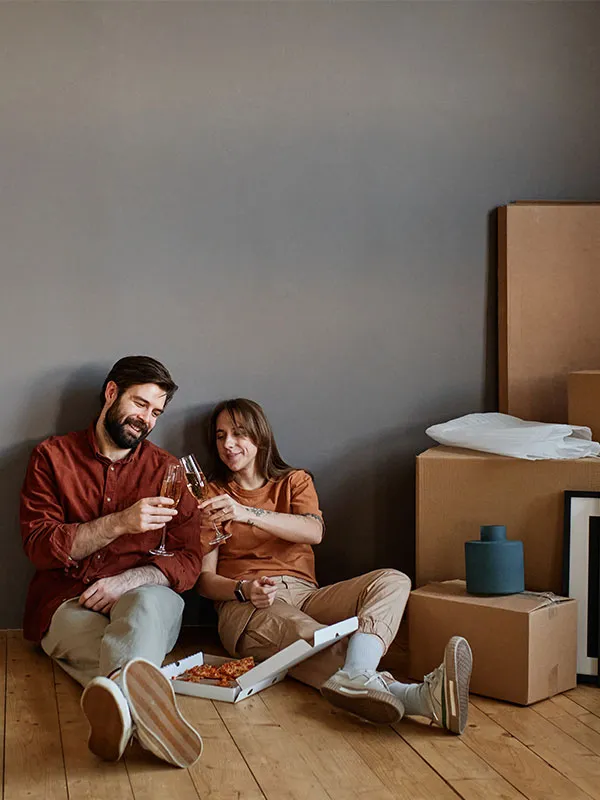 tenants lying on the floor of their newly moved into guaranteed rent home