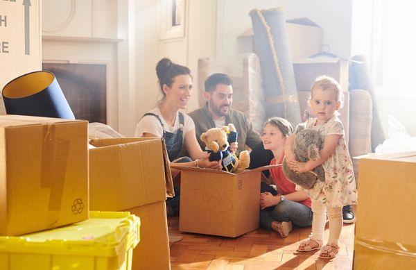 A family with children moving into a rental home